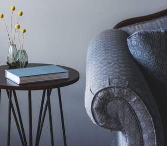 Shot of a blue sofa and a round table